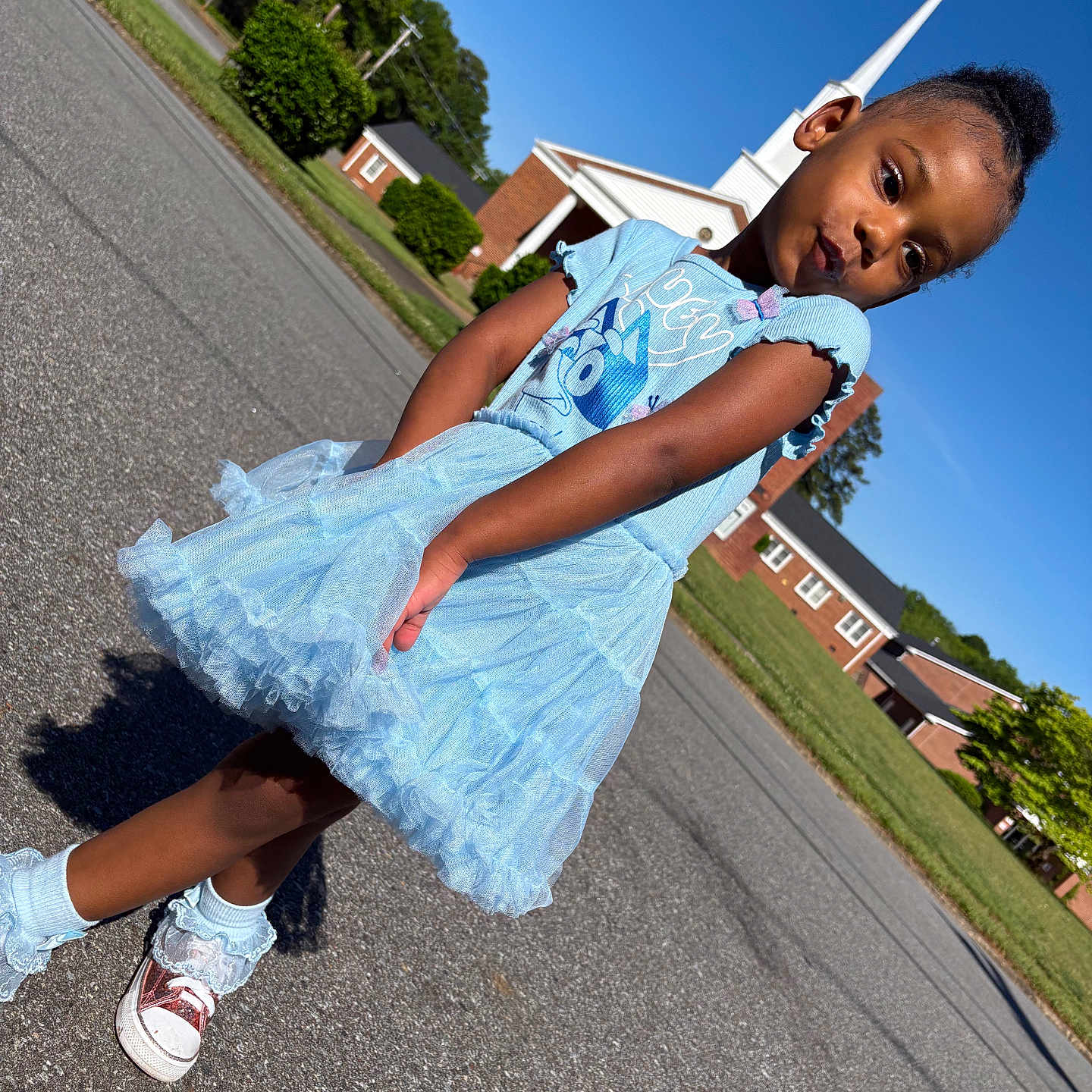 Kehlani joined the competition — help win amazing prizes! child, girl, portrait, outdoor, street, dress, blue_dress, princess_dress, shoes, sneakers, socks, church, steeple, sky, sunny, residential_area, asphalt, standing, posing, fashion