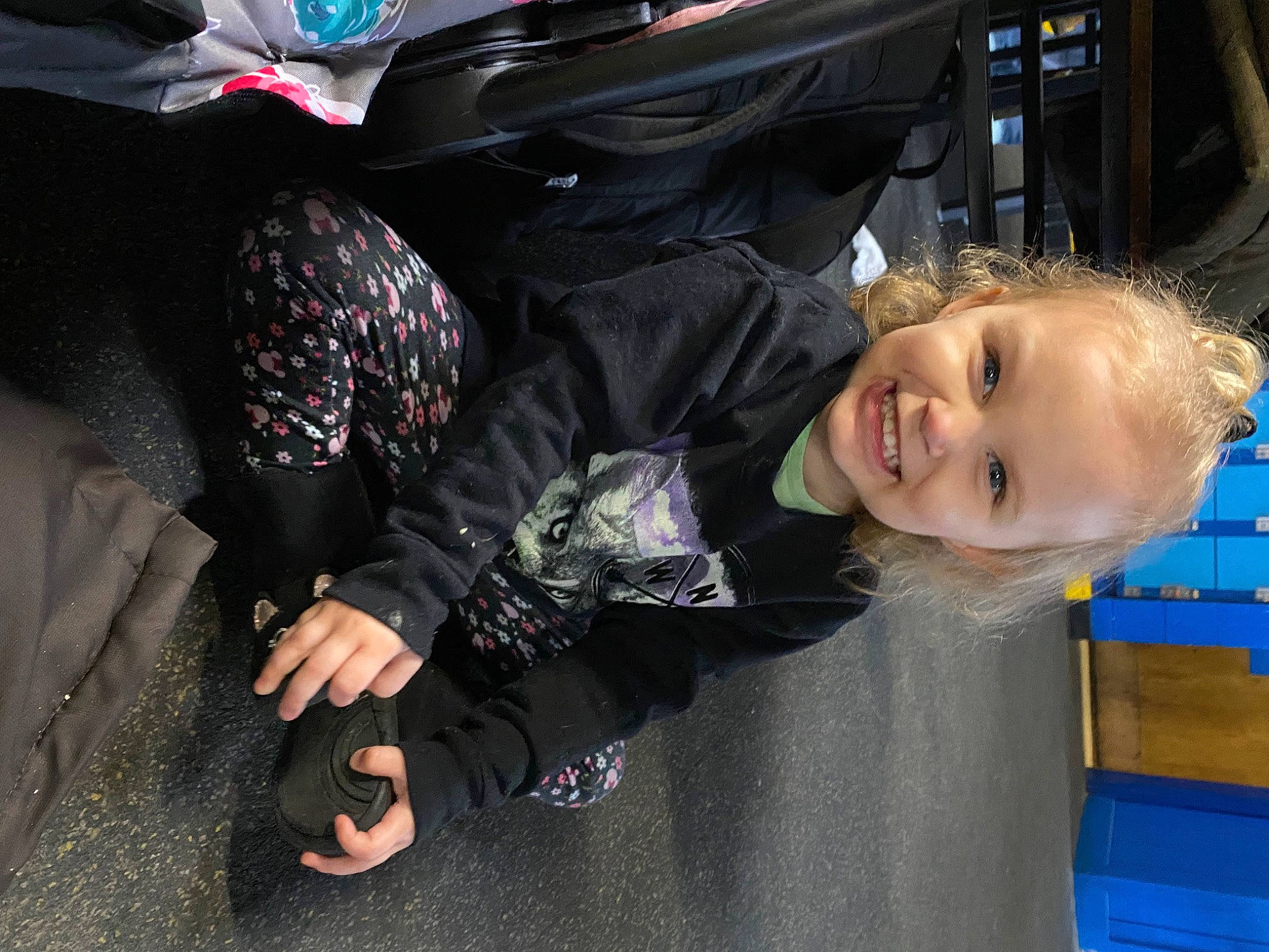 Skylar is registered to the contest to win money with this photo: auto_part, automotive_design, automotive_exterior, automotive_lighting, automotive_tire, blue, bumper, child, electric_blue, family_car, fun, hat, joy, luxury_vehicle, motor_vehicle, person, personal_protective_equipment, smile, toddler, vehicle_door