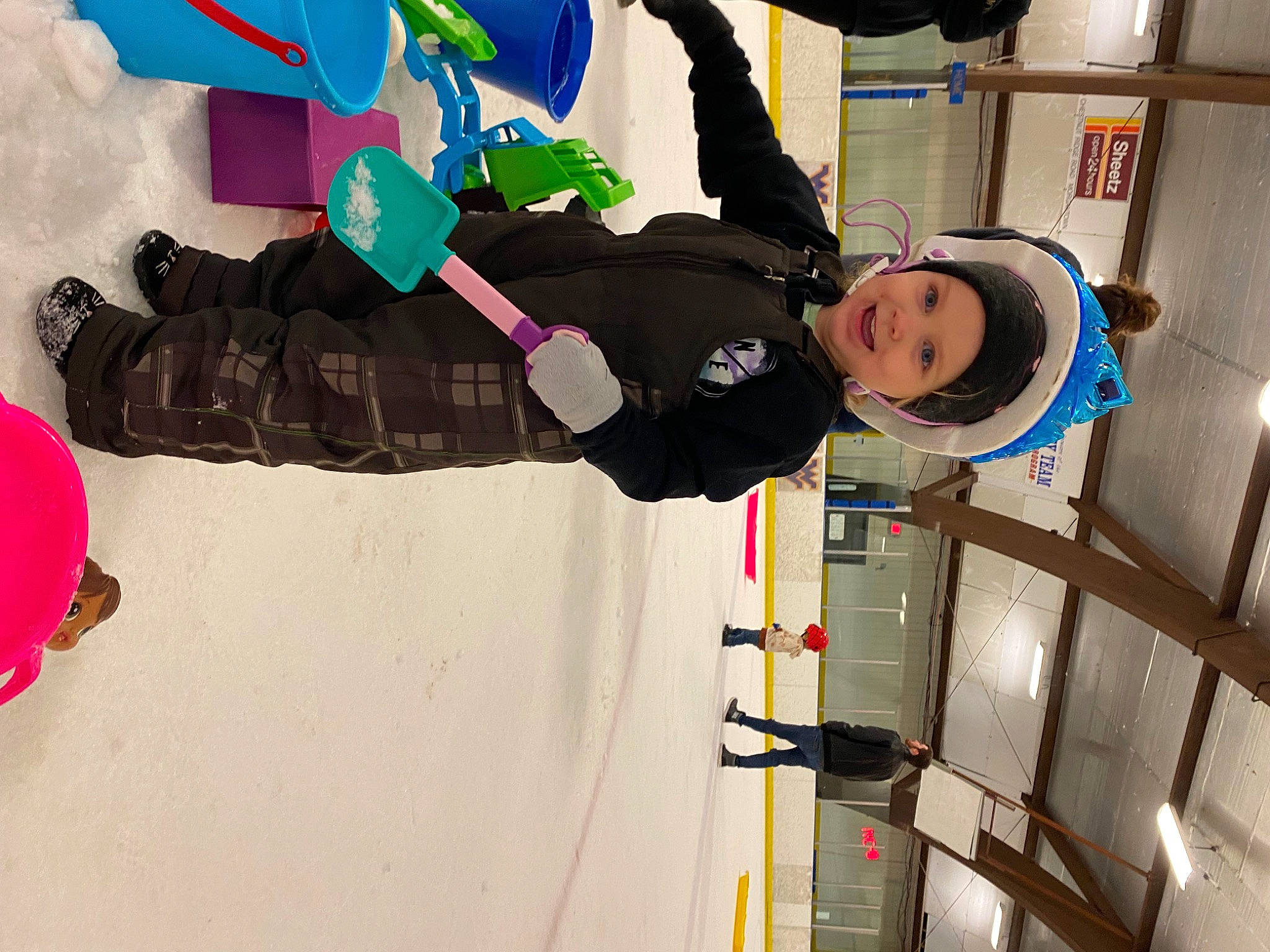 Skylar is registered to the contest to win money with this photo: animation, art, child, costume, fictional_character, fun, glove, headwear, joy, leisure, machine, magenta, person, personal_protective_equipment, play, playing_in_the_snow, recreation, toddler, visual_arts, window