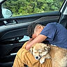 boy, car_interior, casual_clothing, comfort, companion, dog, friendship, greenery, indoor, pants, pet, puppy, rain, relaxation, resting, shoe, sleeping, sock, tshirt, window