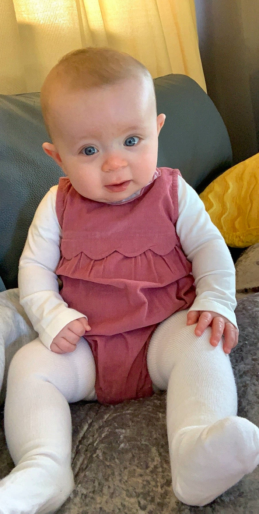 Ayda is registered to the contest to win money with this photo: baby, baby_toddler_clothing, cheek, child, face, leg, person, sitting, skin, toddler