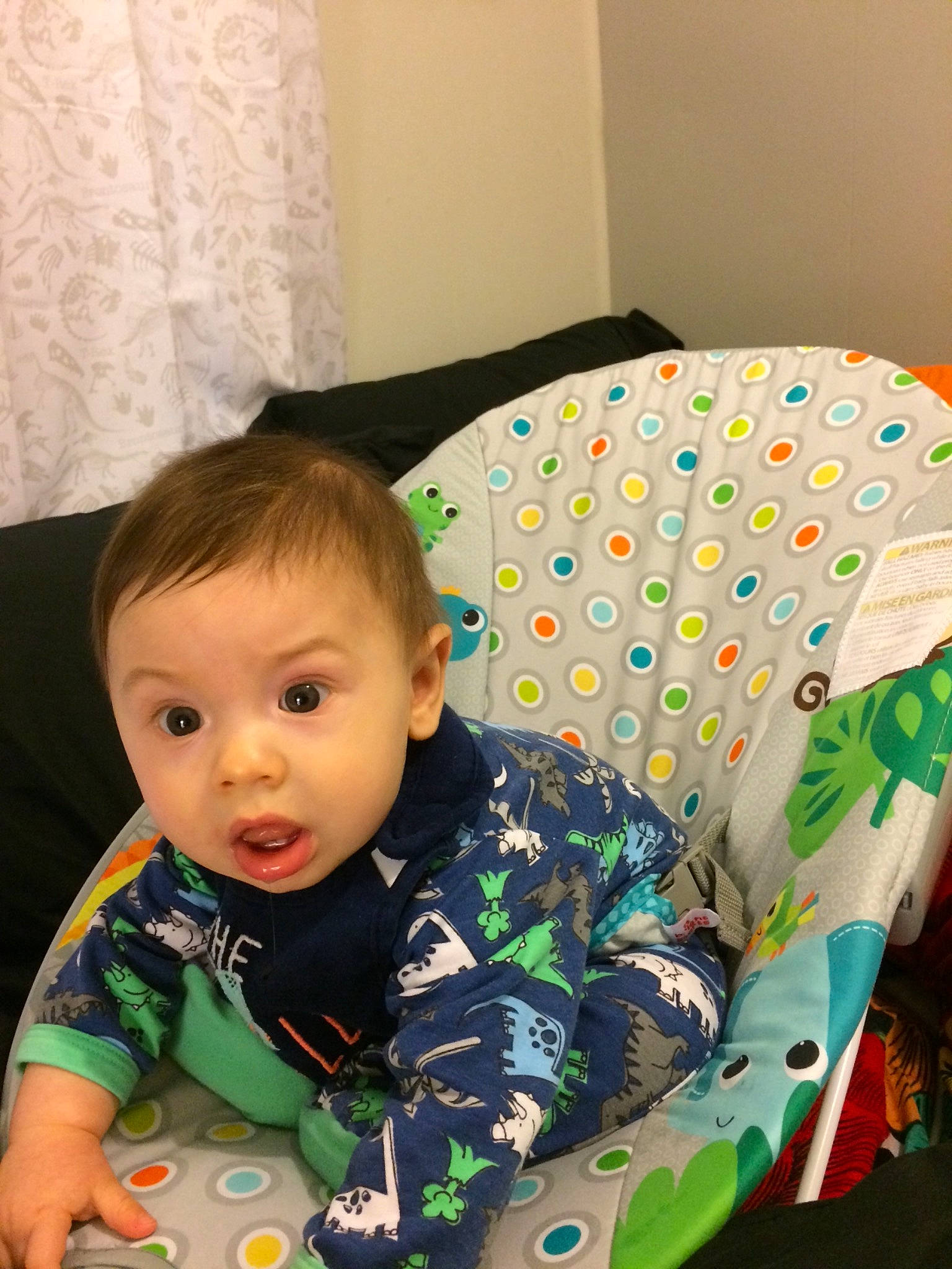 Lucius is registered to the contest to win money with this photo: baby, baby_toys, cheek, child, pajamas, person, play, room, sitting, skin, surprise, toddler