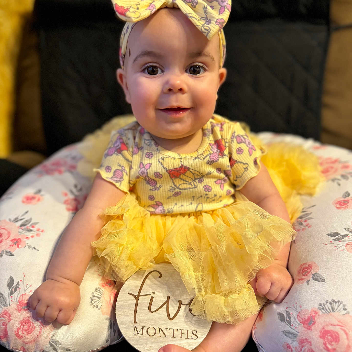 Liliana joined the competition — help win amazing prizes! accessories, baby, bodypart, bonnet, clothing, couch, cushion, dress, face, formalwear, furniture, hat, head, homedecor, person, photography, pillow, portrait, sitting, toy