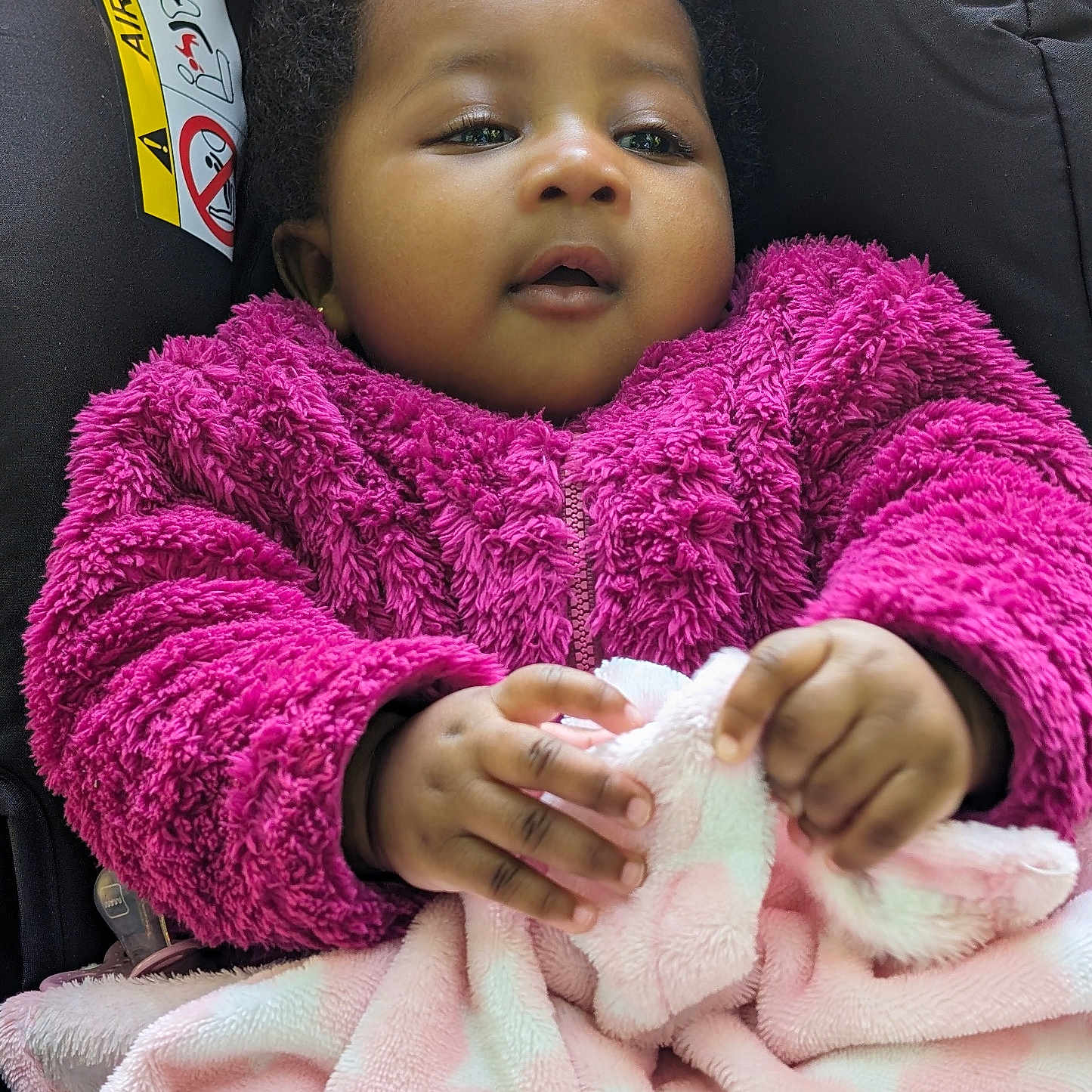 Chisimdi is registered to the contest to win money with this photo: baby, blanket, bodypart, clothing, coat, cushion, face, finger, hand, happy, hat, head, homedecor, jacket, knitwear, person, photography, portrait, smile, sweater
