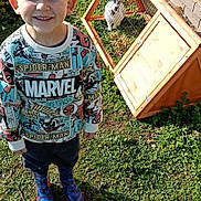 Cruze joined the competition — help win amazing prizes! animal, boots, boy, brick_wall, casual, child, cute, grass, happy, marvel, outdoor, pet, rabbit, rabbit_hutch, smiling, spiderman, sunny, sweater, window, young