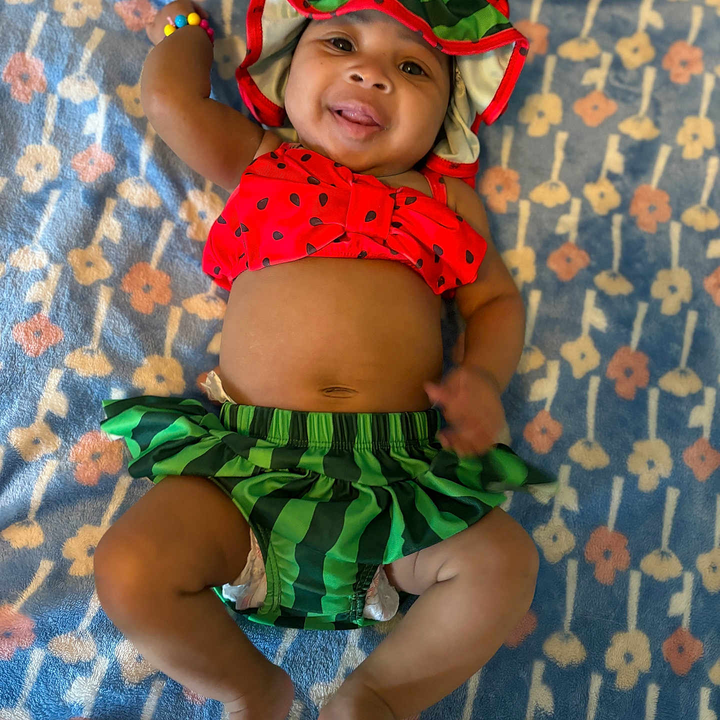 Avaughni joined the competition — help win amazing prizes! baby, bodypart, bonnet, cap, clothing, costume, diaper, face, finger, furniture, hand, happy, hat, head, person, photography, portrait, shorts, smile, swimwear