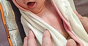 Scarlett joined the competition — help win amazing prizes! baby, infant, towel, hand, person, skin, face, eyes, mouth, newborn, child, cute, expression, wrapped, support, pink, white, soft, care, closeup