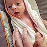 baby, infant, towel, hand, person, skin, face, eyes, mouth, newborn, child, cute, expression, wrapped, support, pink, white, soft, care, closeup