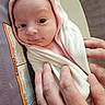 Scarlett is registered to the contest to win money with this photo: baby, infant, towel, hand, wrapped, newborn, cute, portrait, soft, skin, pink_trim, eyes, face, person, holding, closeup, gentle, care, warm, snug