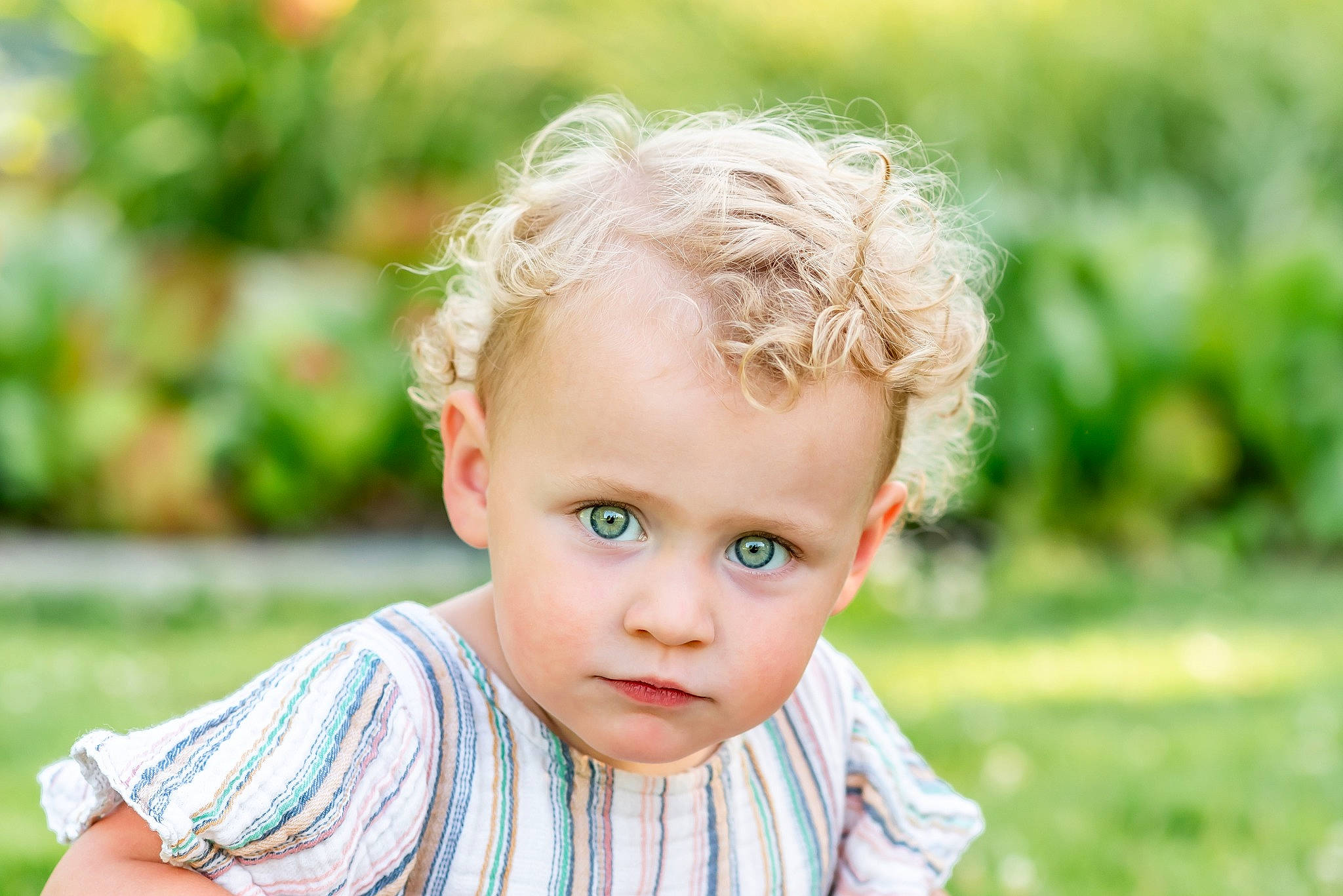 Marley is registered to the contest to win money with this photo: baby, baby_toddler_clothing, blond, cheek, child, eye, flash_photography, fun, grass, grassland, happy, iris, nose, people_in_nature, person, plant, portrait, portrait_photography, sitting, skin