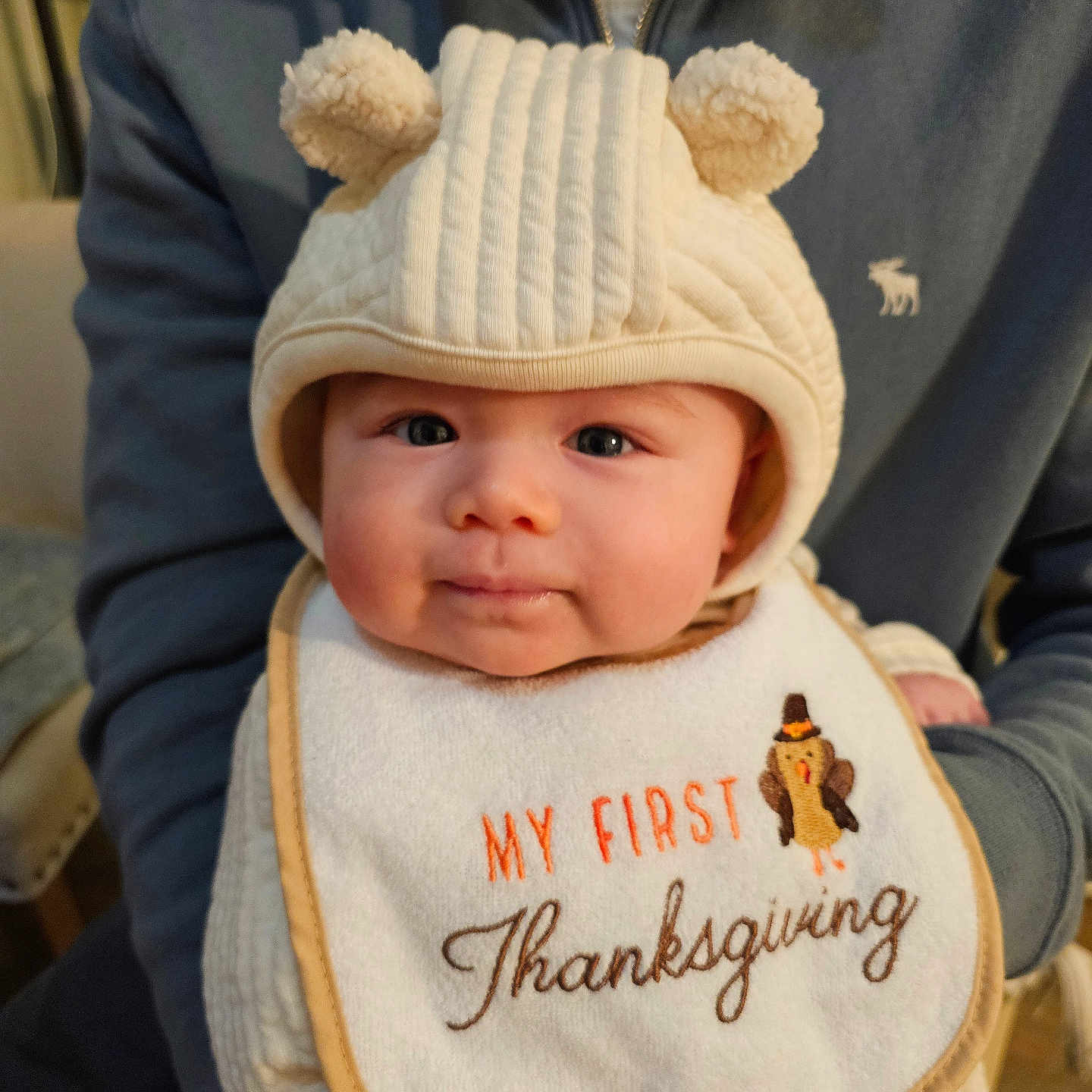 Zeke joined the competition — help win amazing prizes! baby, bear_ears, bib, child, clothing, cute, face, family, hat, holding, holiday, indoor, infant, person, portrait, smile, sweater, thanksgiving, warm, young_child