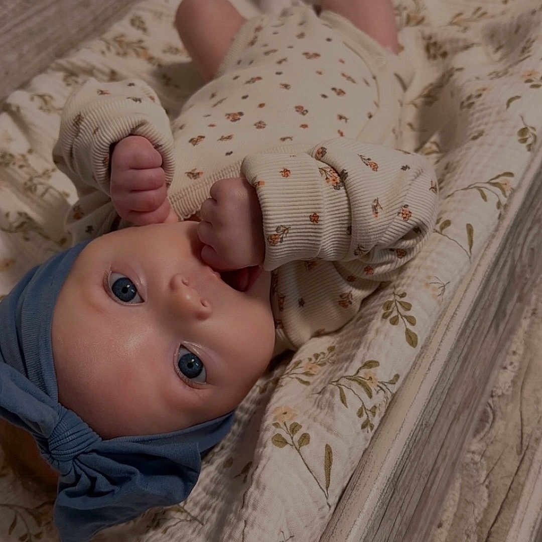 Everleigh is registered to the contest to win money with this photo: baby, bed, blanket, bodypart, cradle, crib, face, finger, furniture, hand, head, infantbed, newborn, person