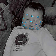 Katalina participe au concours pour gagner de l'argent avec cette photo : baby, sleeping, onesie, butterfly_filter, face, couch, patterned_fabric, child, infant, smiling_sun, text_on_clothing, resting, cozy, indoor, closeup, peaceful, cute, soft_lighting, portrait, casual