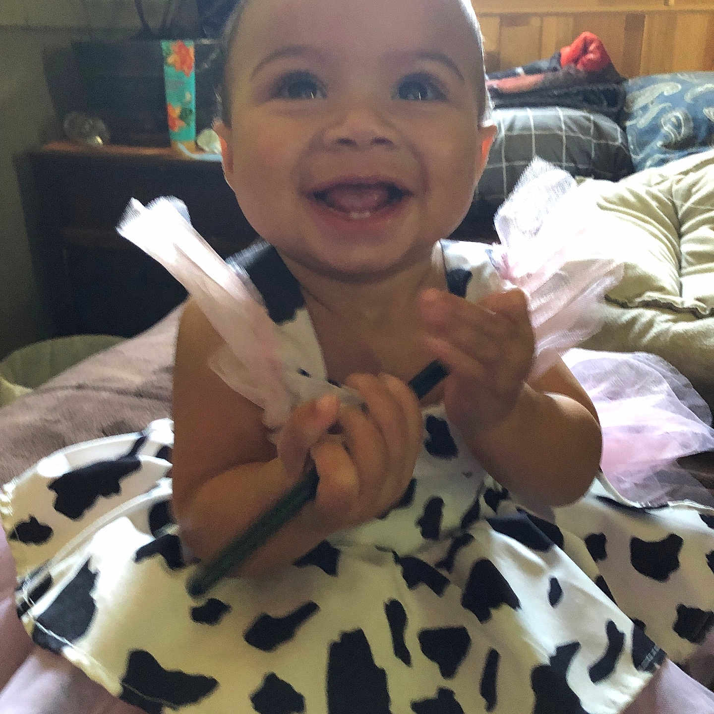 Aurora is registered to the contest to win money with this photo: baby, black_and_white, child, clapping, cute, dress, fun, furniture, happy, indoor, joy, light, pattern, person, plant, smiling, toddler, toy, tulle, window