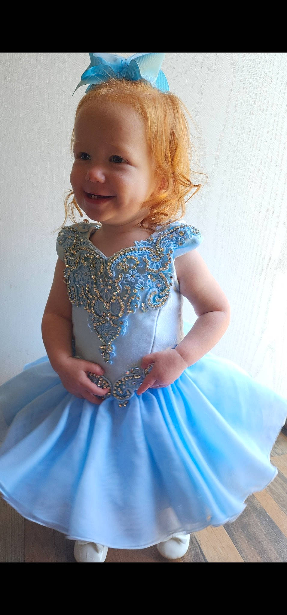 Taylen Crews is registered to the contest to win money with this photo: arm, azure, baby_toddler_clothing, day_dress, dress, face, facial_expression, hair, happy, iris, joint, joy, neck, one_piece_garment, person, pink, shoulder, skin, sleeve, smile