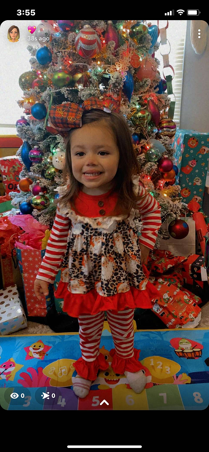 Amila is registered to the contest to win money with this photo: baby_toddler_clothing, blue, child, christmas_ornament, dress, event, fun, happy, holiday, joy, party_supply, pattern, people, person, pink, sleeve, smile, snapshot, standing, textile
