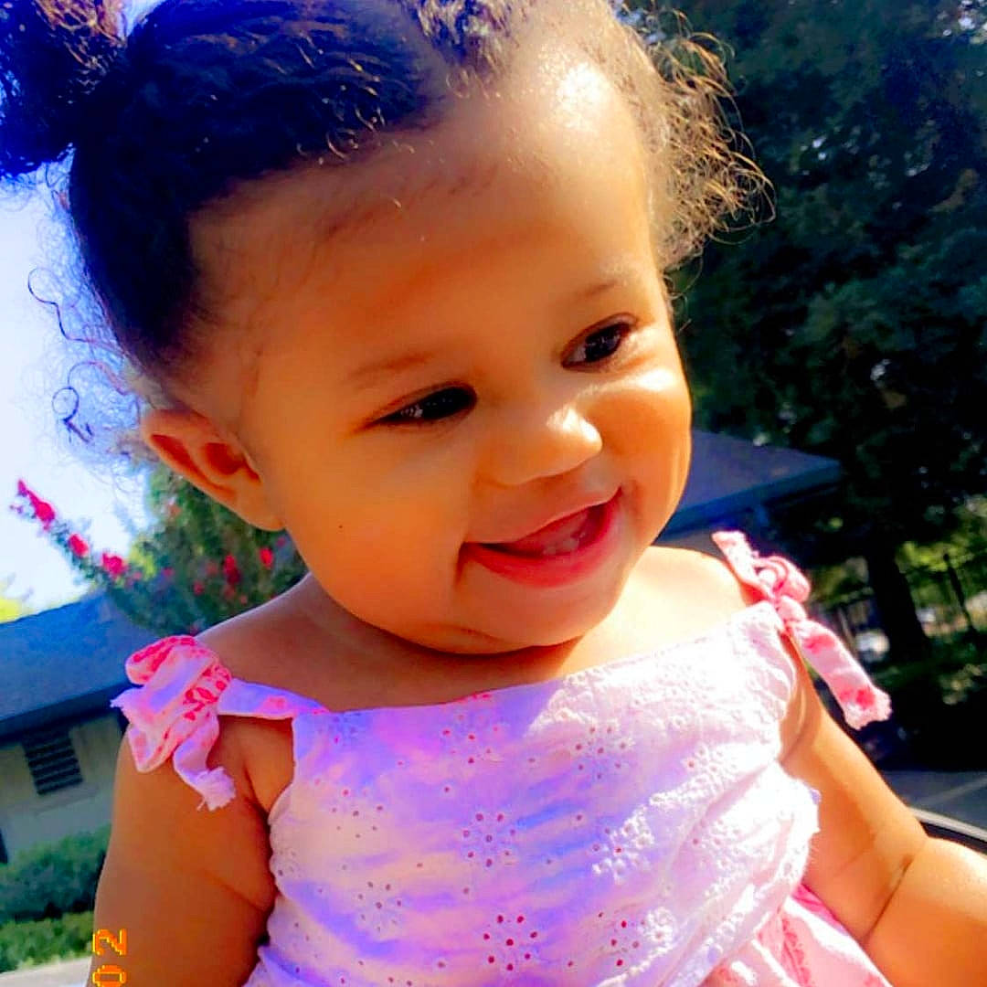 Jazmin is registered to the contest to win money with this photo: baby, beauty, cheek, child, chin, eye, face, facial_expression, forehead, hair, hair_accessory, hairstyle, happy, head, joy, lip, nose, person, pink, skin