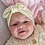 Adah-Jayne is registered to the contest to win money with this photo: baby, smiling, headband, bow, knitted_sweater, cream_color, blanket, soft_texture, portrait, infant, cute, happy, child, closeup, face, apparel, warm, indoors, cozy, sleepwear