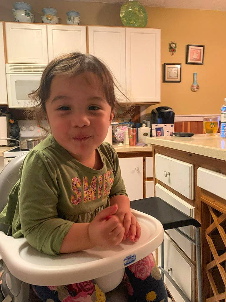 Amelia joined the competition — help win amazing prizes! cabinetry, chair, chest_of_drawers, child, cooking, drawer, flooring, fun, happy, head, kitchen, person, picture_frame, play, room, sitting, smile, t_shirt, thumb, toddler