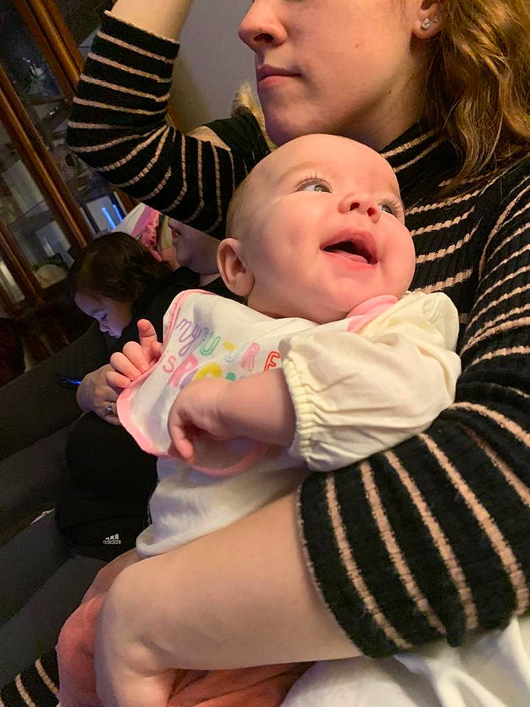 Mila joined the competition — help win amazing prizes! baby, baby_toddler_clothing, cheek, child, comfort, event, finger, fun, gesture, happy, headwear, iris, joint, lap, mouth, person, pink, sitting, skin, thigh