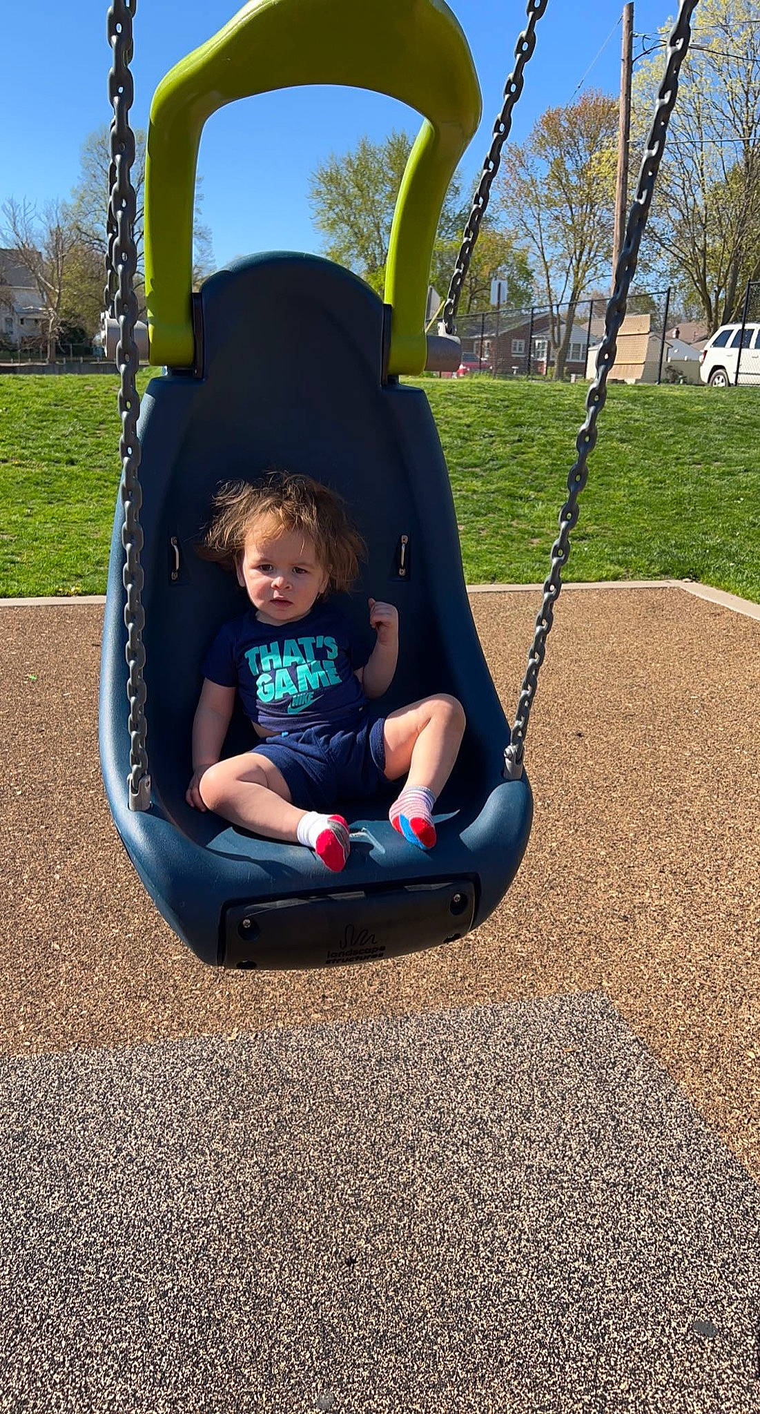 Kyrie joined the competition — help win amazing prizes! automotive_tire, automotive_wheel_system, baby_products, baby_toddler_clothing, city, comfort, electric_blue, fun, grass, leisure, outdoor_play_equipment, person, plant, playground, recreation, sitting, sky, swing, tire, toddler