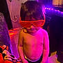 Messiah joined the competition — help win amazing prizes! child, boy, red_glasses, shirtless, indoor, led_lights, purple_light, blanket, tv_screen, floor, wall, power_strip, cables, furniture, toy, decor, face, hair, expression, glasses