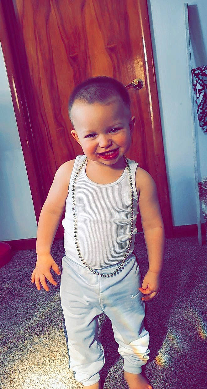 Bowen is registered to the contest to win money with this photo: active_tank, baby, baby_toddler_clothing, cheek, chest, eye, eyebrow, face, floor, happy, head, iris, joy, leg, lip, neck, person, skin, sleeve, smile