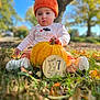 Finleigh Rae is registered to the contest to win money with this photo: baby, child, orange_hat, pumpkin, autumn, grass, outdoor, fall, milestone, cute, seasonal, leaves, nature, person, infant, knit_hat, plaid_pants, white_shirt, holiday, seven_months