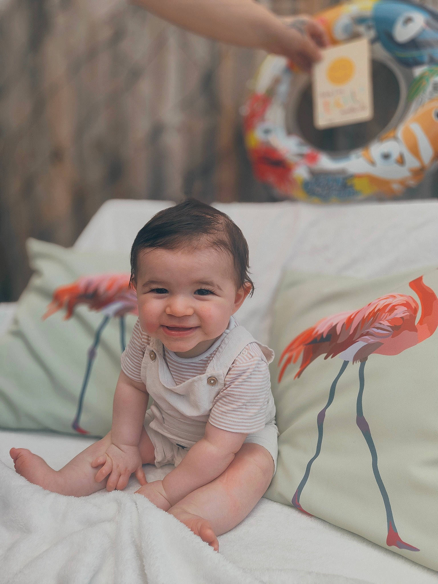 Layton is registered to the contest to win money with this photo: baby, baby_toddler_clothing, child, event, finger, flooring, fun, happy, human, joy, leisure, linens, people, person, room, sitting, skin, sleeve, smile, t_shirt