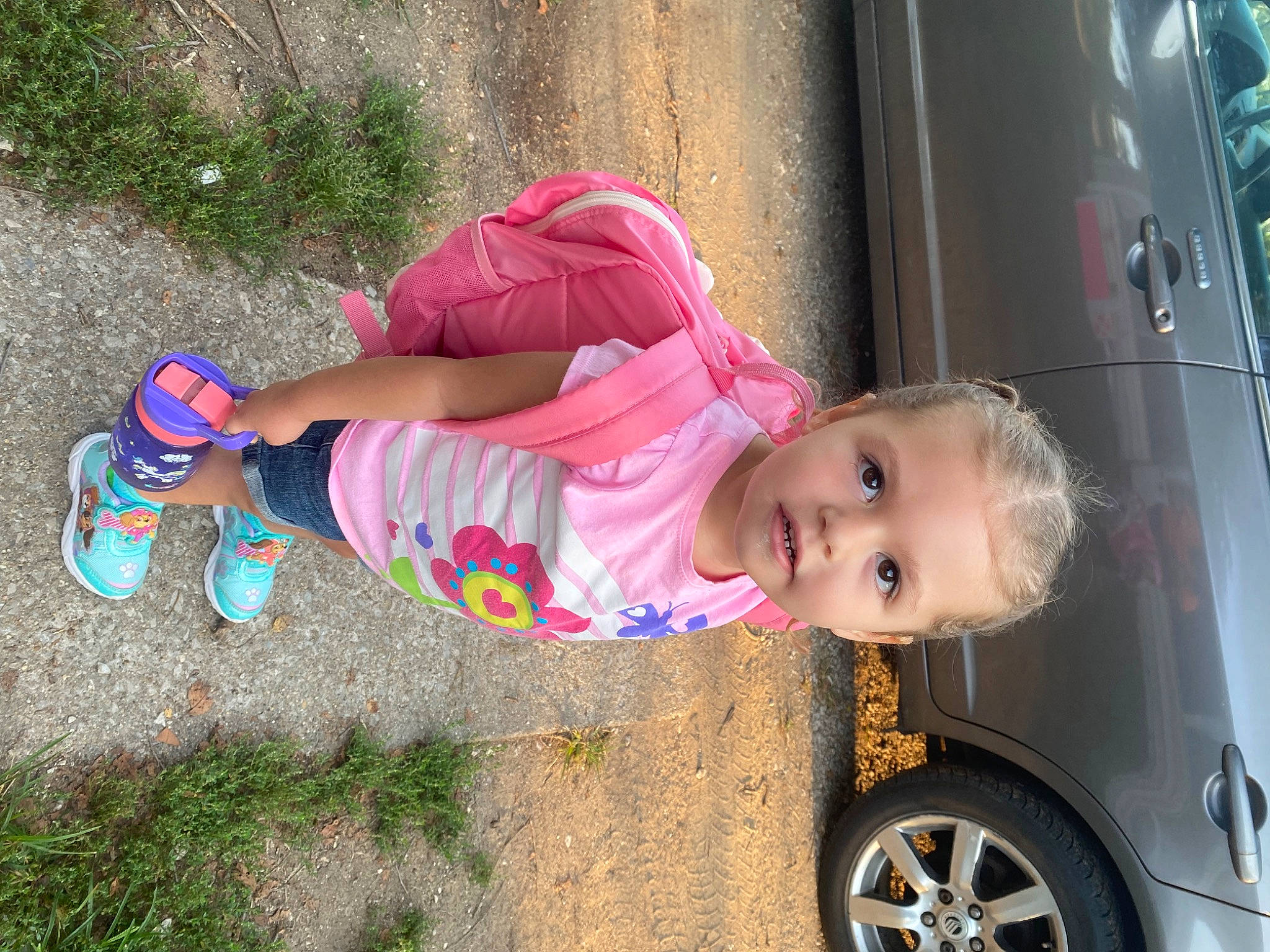 Kaidence is registered to the contest to win money with this photo: automotive_exterior, automotive_lighting, automotive_tire, baby_toddler_clothing, beauty, car, child, fender, grass, hubcap, motor_vehicle, person, pink, plant, rim, tire, toddler, tree, vehicle, vehicle_door