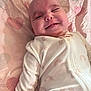 Ella Mae joined the competition — help win amazing prizes! baby, smiling, infant, blanket, hearts, onesie, sleepwear, cute, face, happy, child, lying_down, soft, pattern, fabric, cozy, peaceful, portrait, newborn, comfort