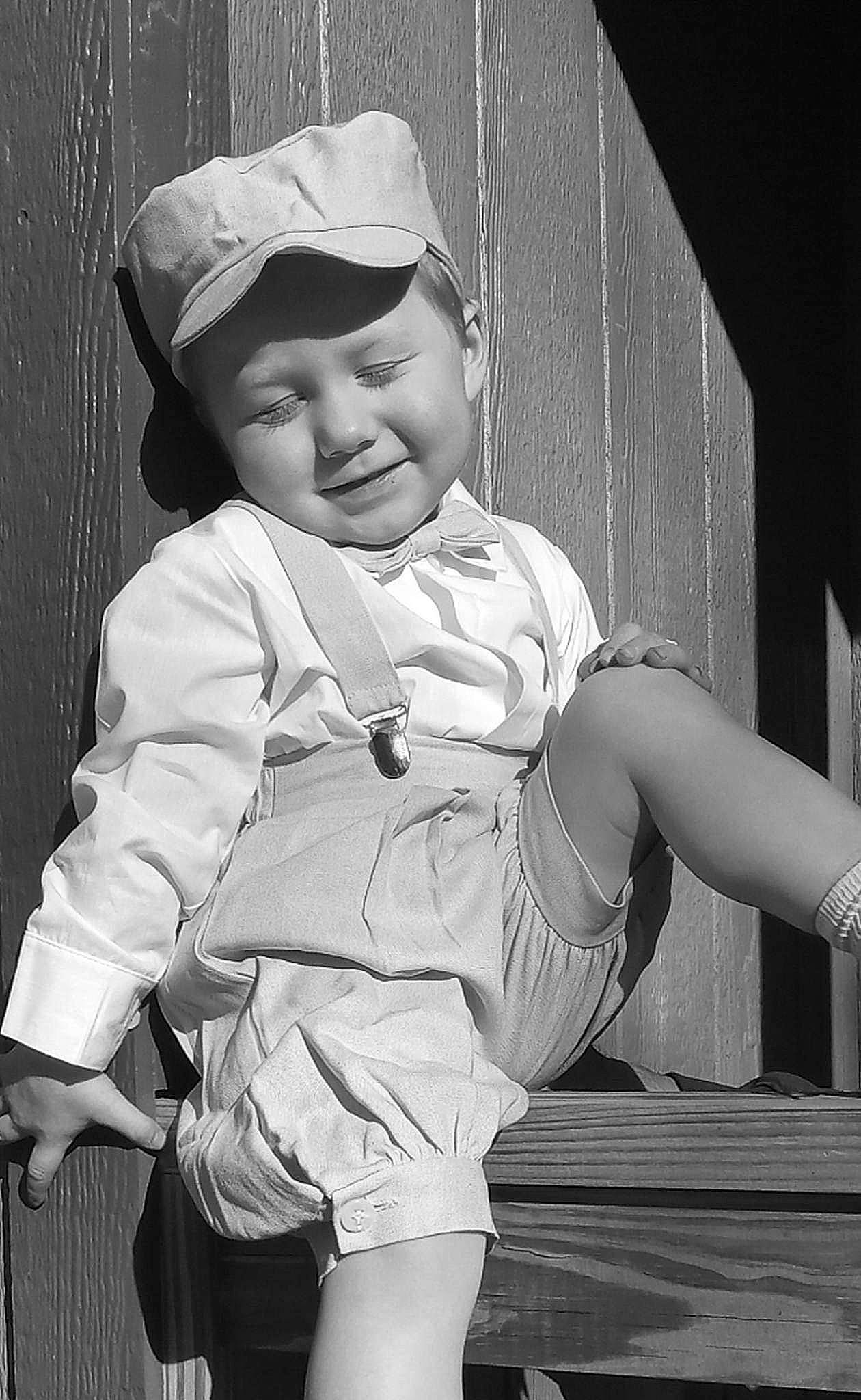 Shyloh is registered to the contest to win money with this photo: arm, baby, baby_toddler_clothing, baseball_cap, black_and_white, cap, child, clothing, cool, flash_photography, hat, headgear, headwear, monochrome, monochrome_photography, person, sleeve, smile, standing, style