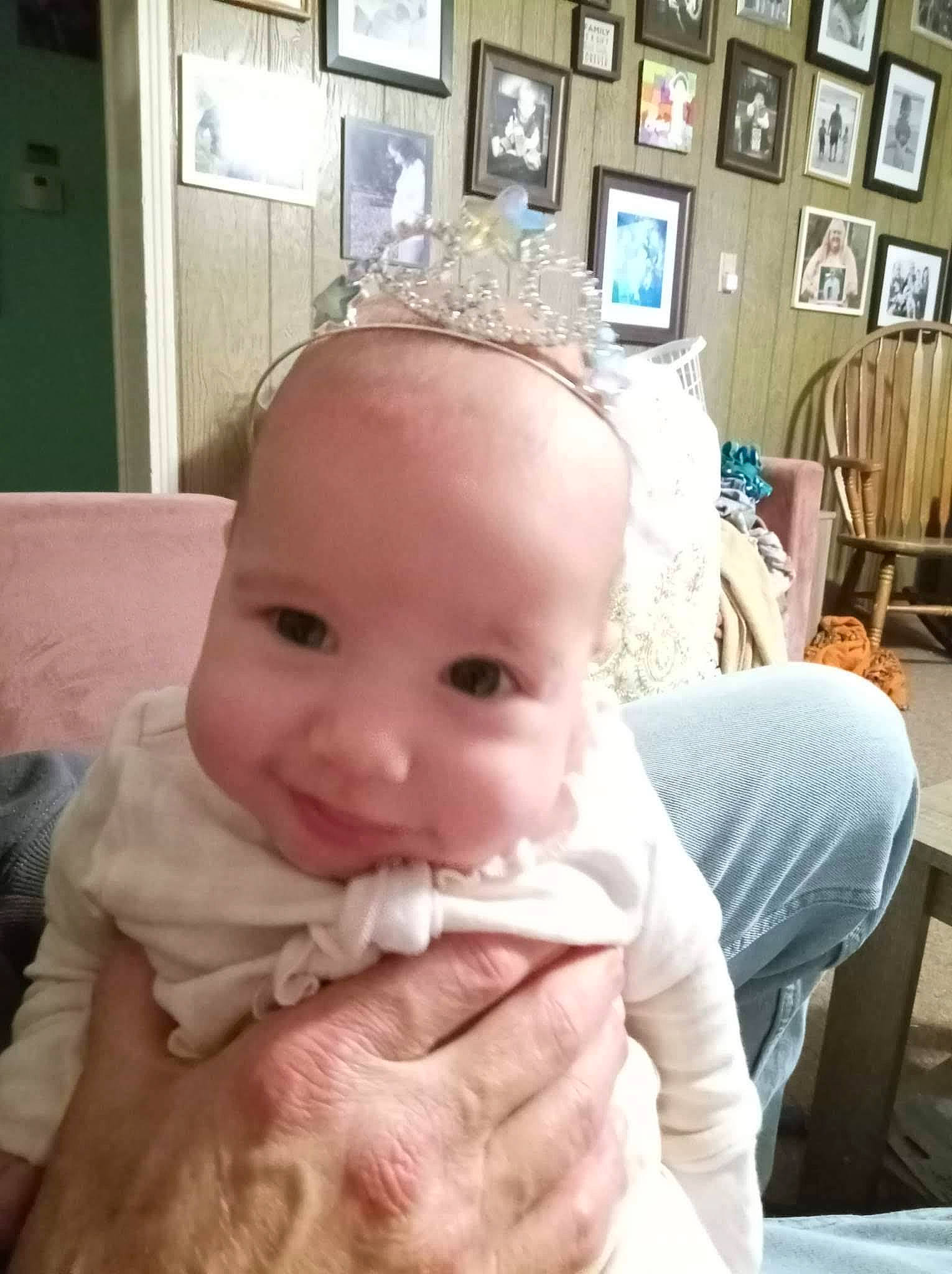 Brylnn is registered to the contest to win money with this photo: baby, baby_toddler_clothing, chair, cheek, ear, eye, eyelash, finger, gesture, happy, jaw, joy, lip, nail, nose, person, picture_frame, sitting, skin, smile