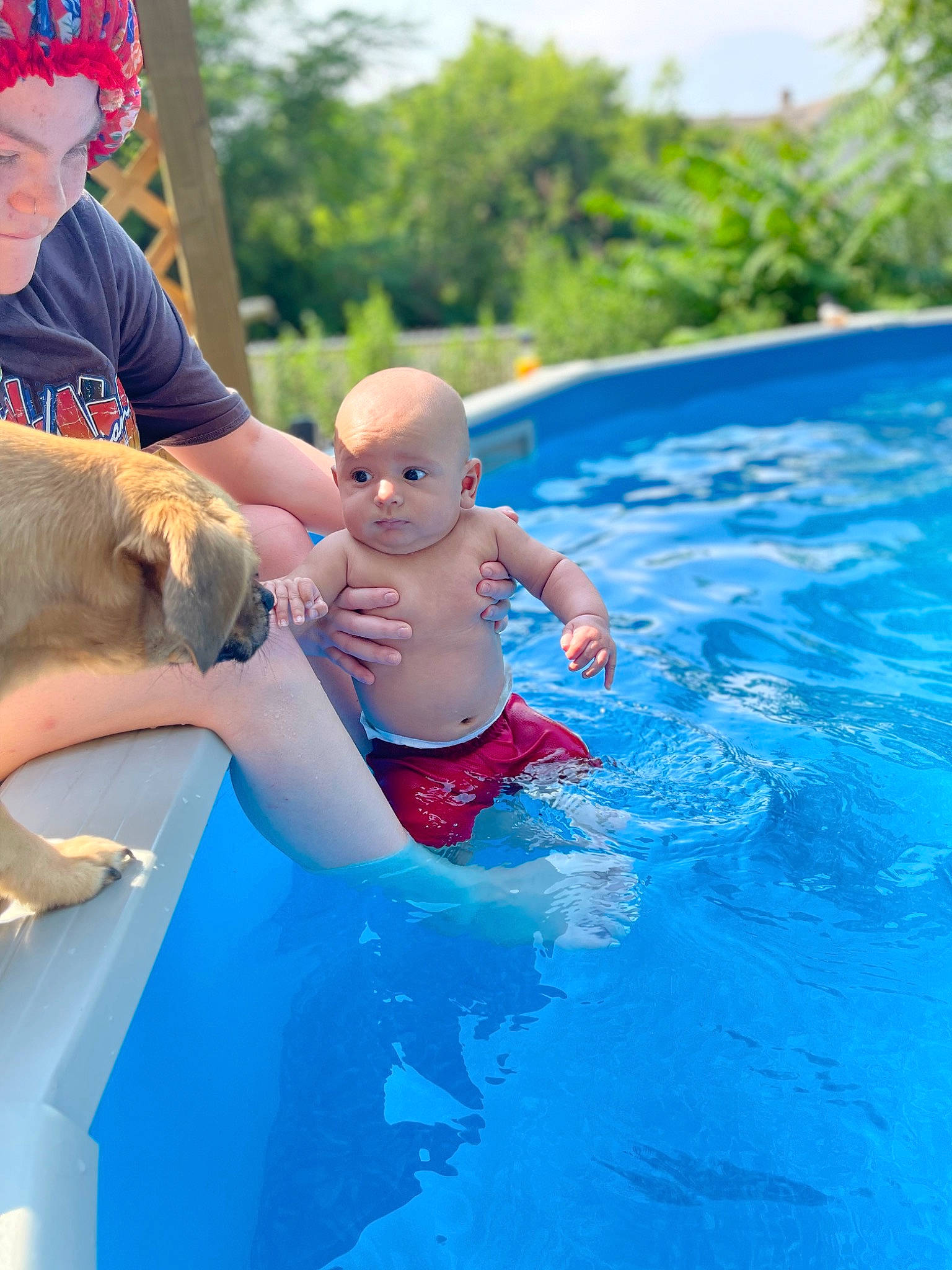 Camari is registered to the contest to win money with this photo: azure, baby, bathing, child, fun, happy, hat, indoor_games_and_sports, leisure, nonbuilding_structure, outdoor_recreation, person, personal_protective_equipment, play, pool, recreation, shorts, sky, swimming_pool, toddler