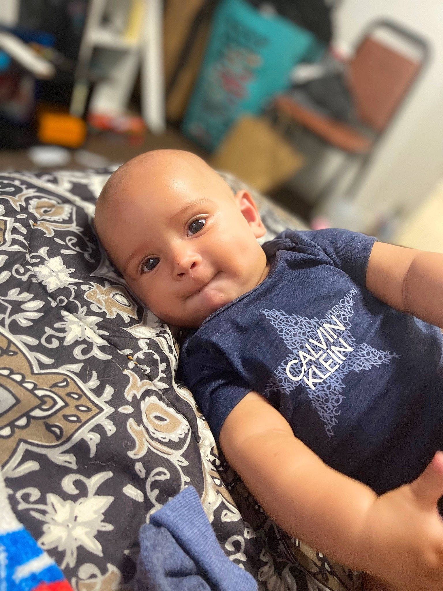 Camari is registered to the contest to win money with this photo: abdomen, baby, bedding, chair, child, comfort, couch, elbow, flooring, fun, happy, linens, pattern, person, room, sitting, t_shirt, toddler