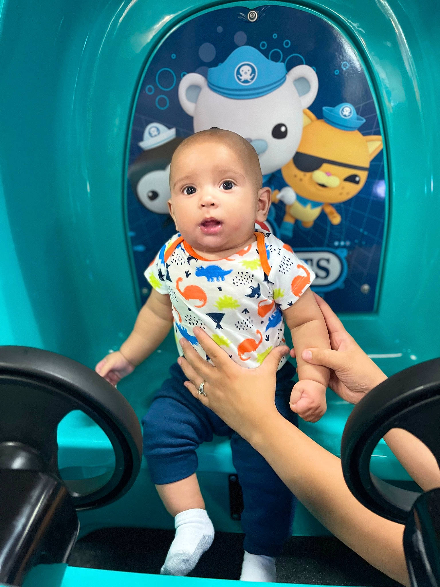 Camari joined the competition — help win amazing prizes! aqua, azure, baby, baby_products, baby_toddler_clothing, blue, child, electric_blue, fun, happy, leisure, person, product, recreation, shorts, sitting, snapshot, surprise, t_shirt, toddler