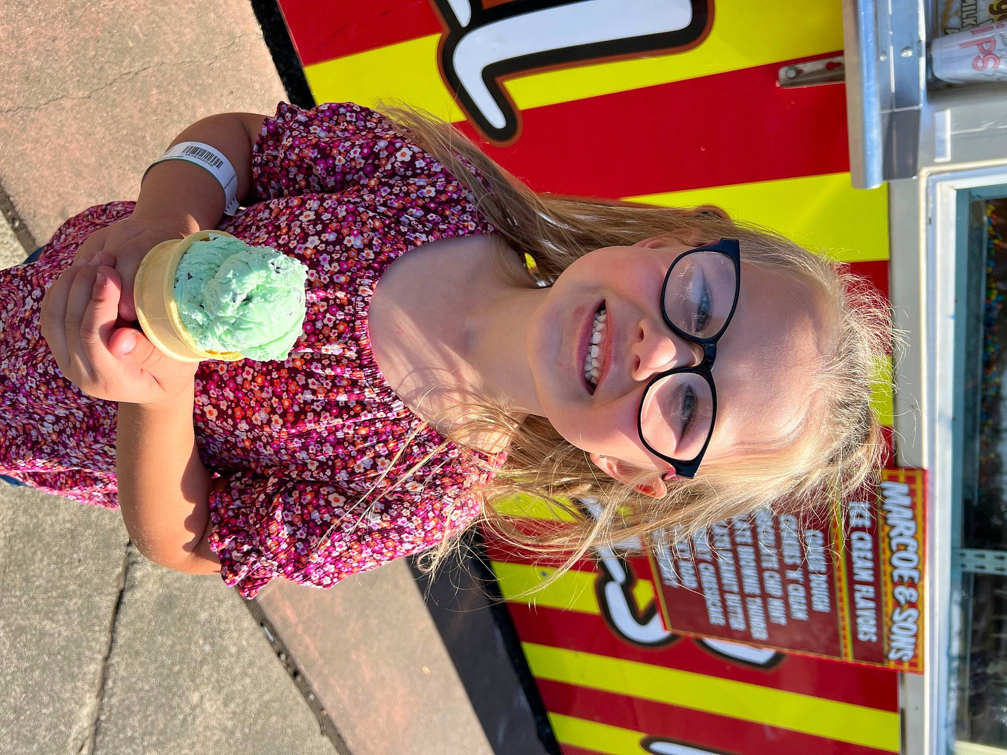 Mckinley is registered to the contest to win money with this photo: child, event, eyewear, fashion_accessory, fun, happy, joy, magenta, party_supply, pattern, person, red, smile, toddler