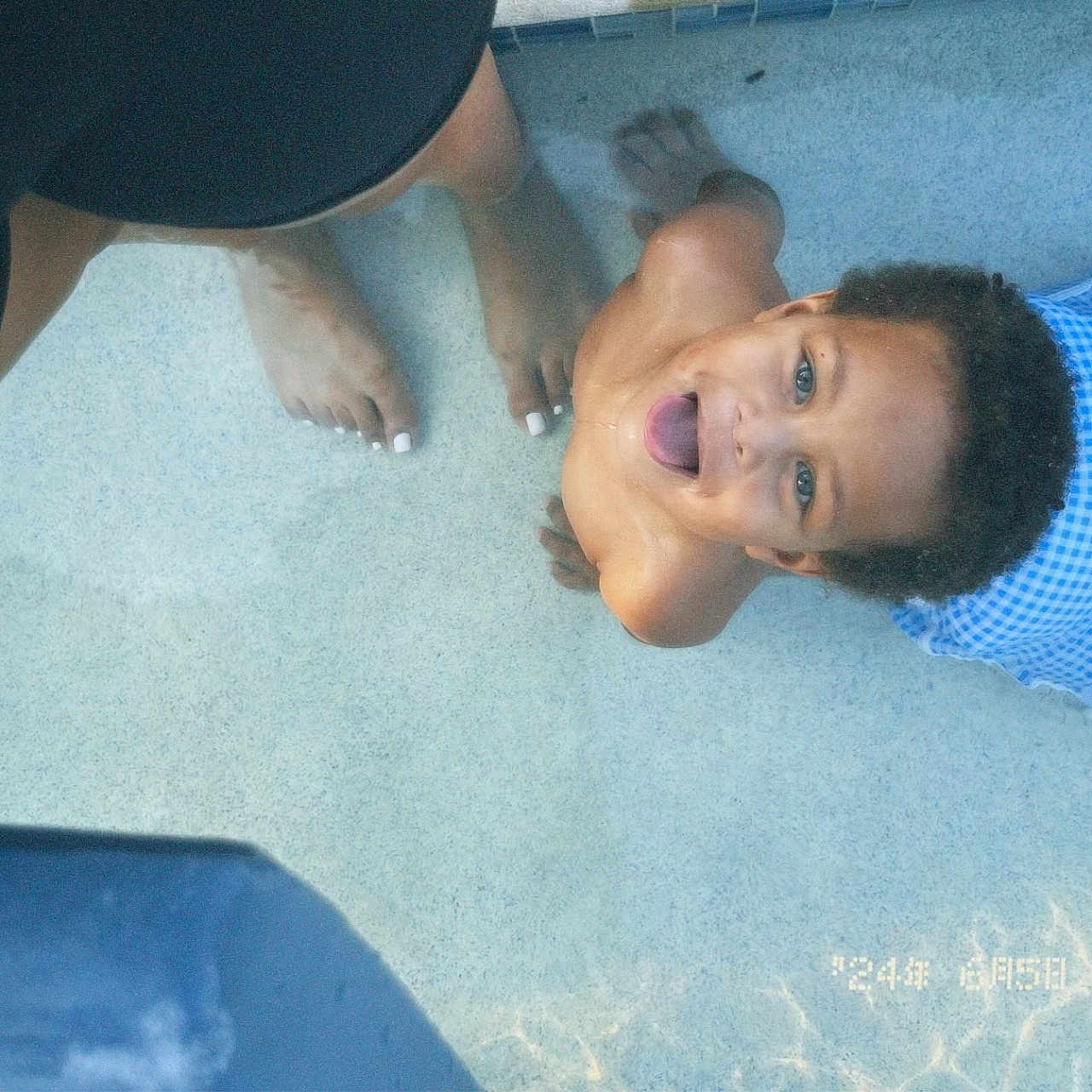 Royal is registered to the contest to win money with this photo: baby, barefoot, bodypart, cap, clothing, face, happy, hat, head, mouth, outdoors, person, photography, pool, portrait, shorts, summer, swimwear, teeth, water