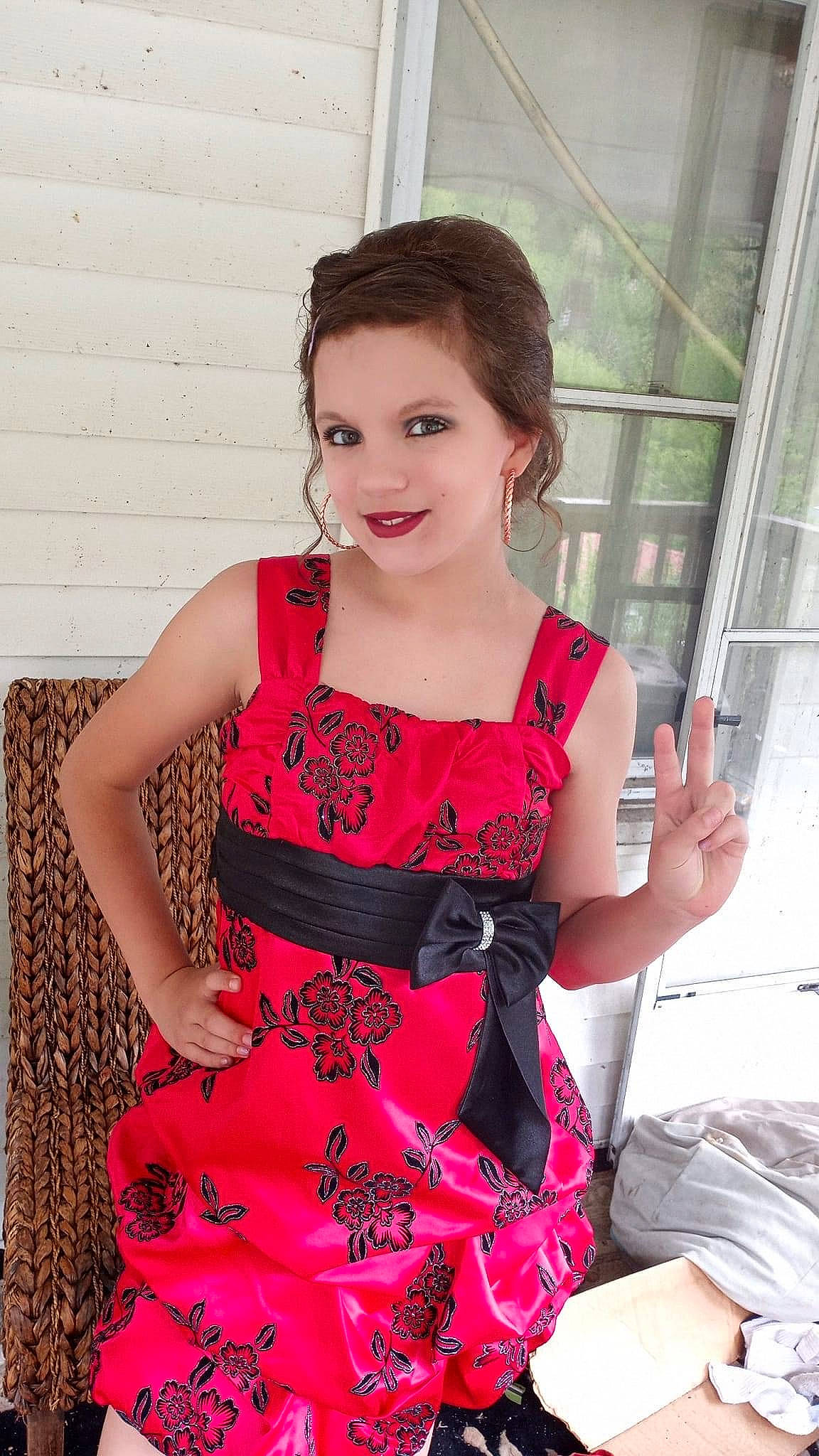 Natalie Kennady is registered to the contest to win money with this photo: black_hair, day_dress, fashion, fashion_design, formal_wear, happy, human_leg, jewellery, joy, long_hair, magenta, neck, one_piece_garment, pattern, person, pink, shoulder, sleeve, smile, thigh