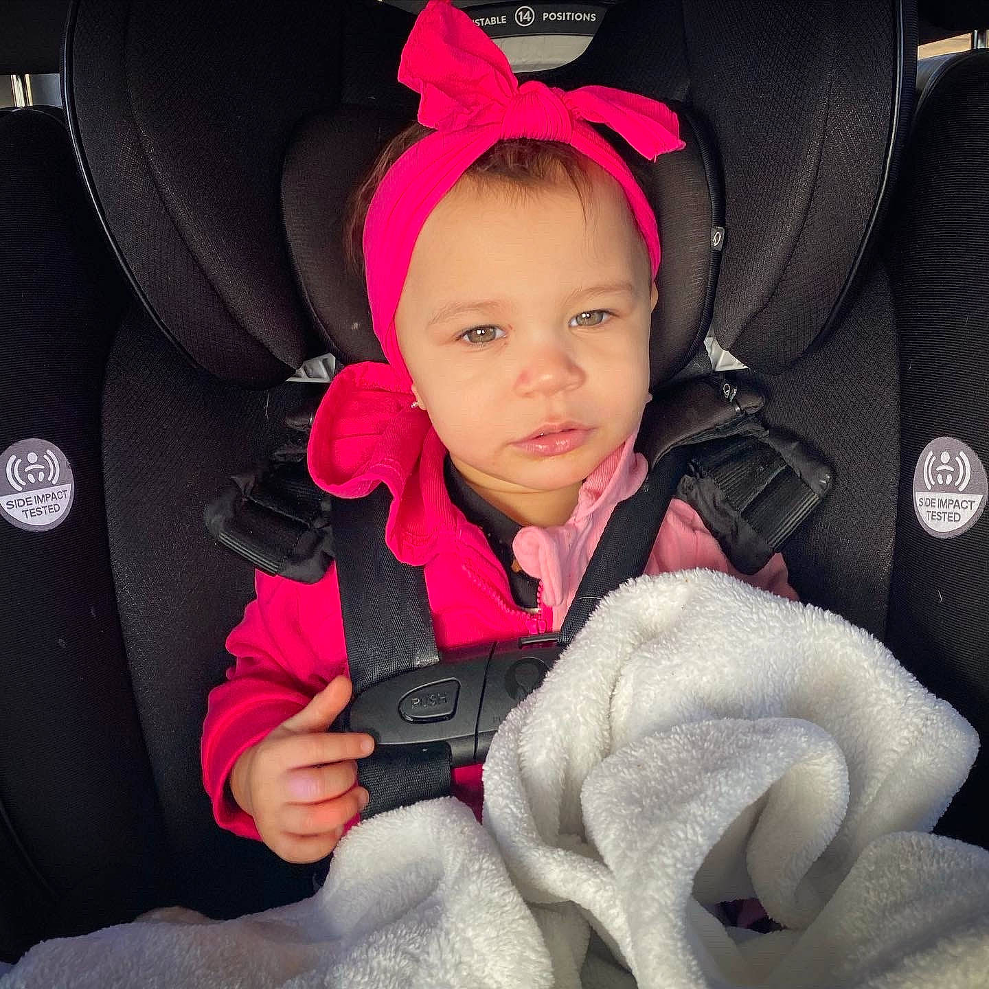 Cahlani is registered to the contest to win money with this photo: auto_part, baby, baby_carriage, baby_in_car_seat, baby_products, car_seat, child, comfort, finger, happy, head_restraint, nail, outerwear, person, pink, product, skin, steering_wheel, toddler, vehicle_door
