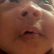 Rahmani Kidd is registered to the contest to win money with this photo: baby, face, close_up, eyes, nose, mouth, skin, infant, portrait, child, expression, curious, soft_lighting, indoors, young, head, cheeks, human, person, blurred_background