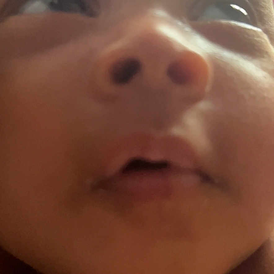 Rahmani Kidd is registered to the contest to win money with this photo: baby, blurred_background, cheeks, child, close_up, curious, expression, eyes, face, head, human, indoors, infant, mouth, nose, person, portrait, skin, soft_lighting, young