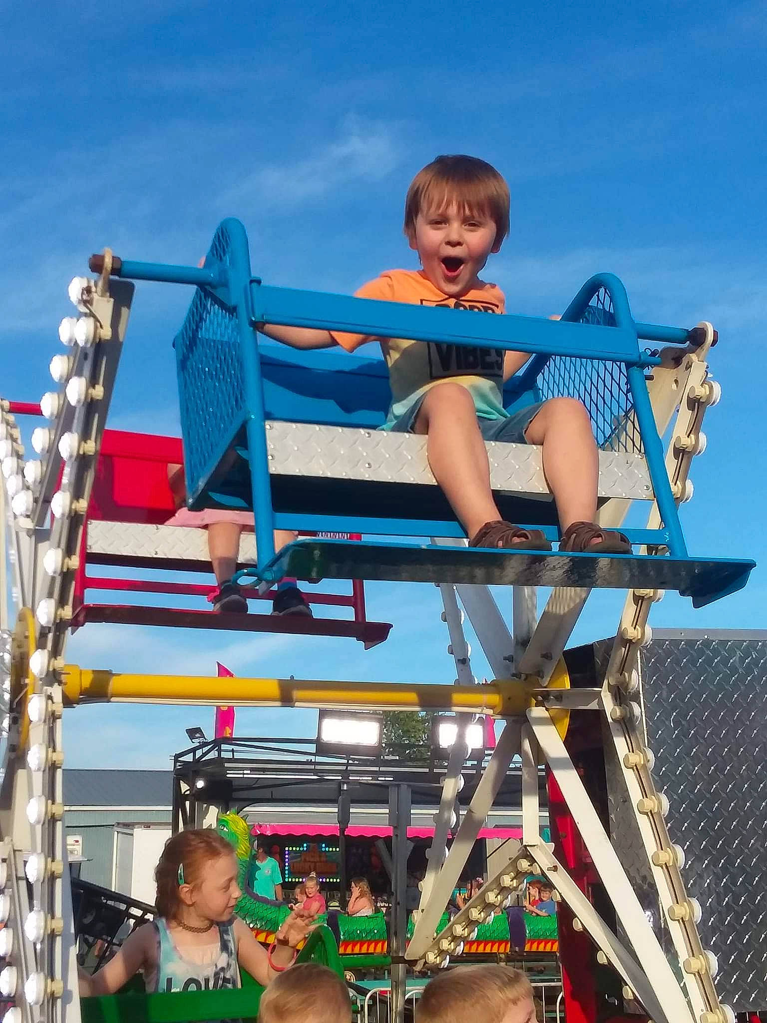 Landon joined the competition — help win amazing prizes! amusement_park, amusement_ride, child, city, cloud, electric_blue, event, fun, happy, leisure, nonbuilding_structure, people, person, recreation, shorts, sky, smile, t_shirt, thigh, travel