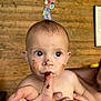 Swan participe au concours pour gagner de l'argent avec cette photo : baby, child, chocolate, closeup, colorful, curious, cute, decor, expression, face, finger, hand, indoor, messy, naked_torso, person, playful, skin, wide_eyes, wooden_wall