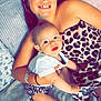 Maïssa participe au concours pour gagner de l'argent avec cette photo : baby, baby_clothes, blanket, child, couch, face, family, happy, headband, indoors, leopard_print, patterned_clothing, person, portrait, sitting, skin, smiling, toddler, woman, young_girl