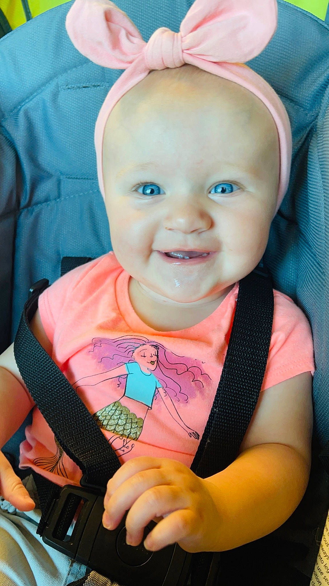 Madisyn is registered to the contest to win money with this photo: azure, baby, baby_carriage, baby_products, baby_toddler_clothing, cheek, child, electric_blue, fashion_accessory, fun, happy, hat, headpiece, iris, person, pink, portrait_photography, sitting, skin, smile