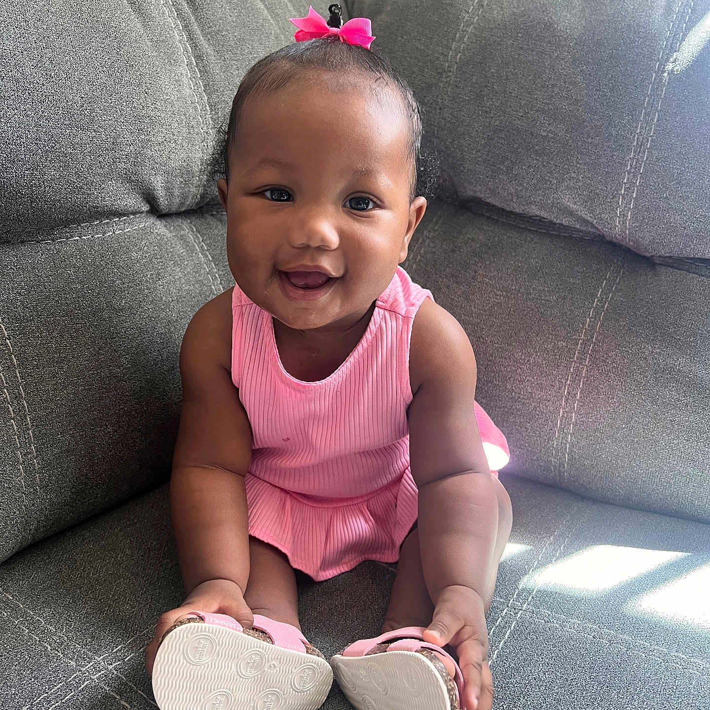 Cianey is registered to the contest to win money with this photo: architecture, baby, building, clothing, couch, cushion, face, footwear, furniture, happy, head, homedecor, indoors, pants, person, photography, portrait, shoe, sitting, smile