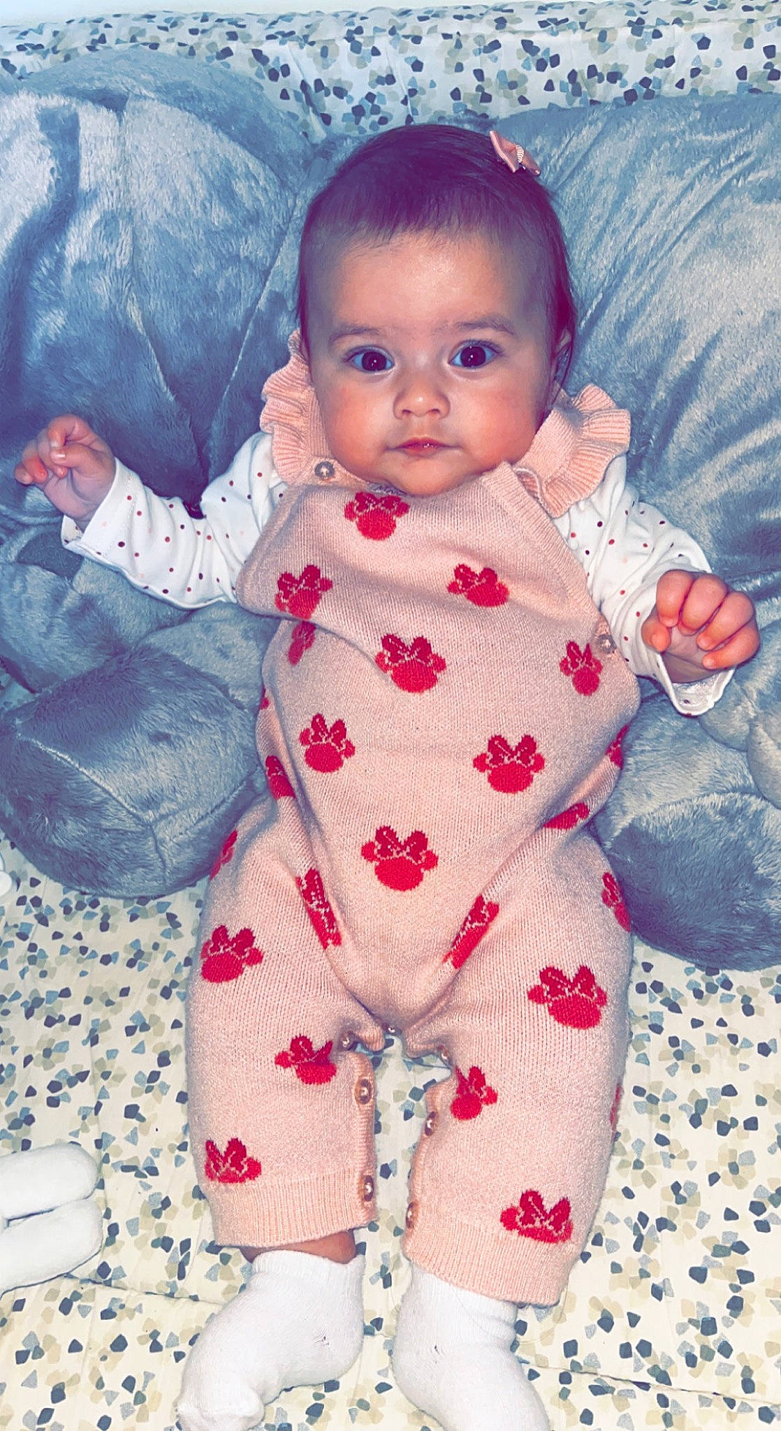 Kamila participe au concours pour gagner de l'argent avec cette photo : arm, baby, baby_toddler_clothing, cheek, child, eye, face, finger, happy, head, iris, lip, nose, pattern, person, pink, purple, skin, sleeve, textile