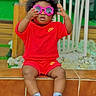 child, toddler, baby, portrait, sitting, sunglasses, pink_glasses, curly_hair, red_outfit, nike, fashion, smiling, indoor, stairs, tiles, shoes, sportswear, playful, colorful, photography