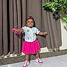 Jazlynn is registered to the contest to win money with this photo: child, toddler, girl, portrait, standing, smiling, pouting, pink_skirt, pink_bow, sunglasses, sneakers, fashion, indoors, curtains, houseplant, marble_floor, clothing, bracelet, photography, colorful